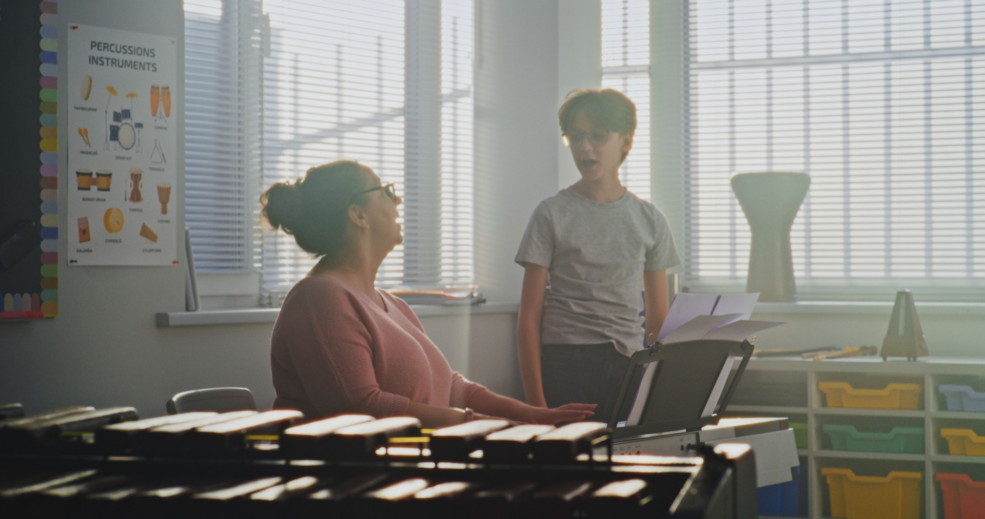 Talented Boy Singing Song During Vocal Lesson. Music Teacher Playing Piano, Supporting Young Student